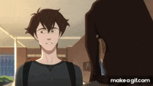 a man and a woman are standing next to each other in a room .