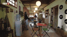 a room with tables and chairs and a sign that says trt1 on it