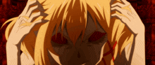 a close up of a girl with red eyes holding her head