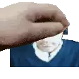 a hand is holding a man 's head in front of a blue shirt .