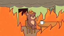 a teddy bear with a hat sits at a table with a cup of coffee