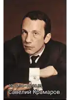 a man wearing a white shirt and tie looks at the camera