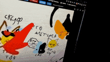 a computer screen shows a drawing of patrick star and a cat with the word cat visible