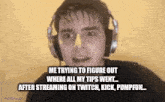 a man wearing headphones is making a funny face while talking on a video call .