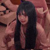 a girl with blue hair is sitting in a pink chair that says furnature on it