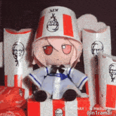 a stuffed doll wearing a kfc bucket hat is sitting in a box