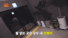 a woman wearing sunglasses stands in a dark room with a sign that says exit