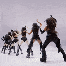 a group of women are dancing and the word choom is on the bottom