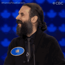 a man with a beard has a name tag that says lee on it