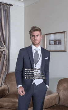a man in a suit and tie is standing in a room with a couch