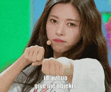 a girl with long hair is pointing her fist at the camera with the words id : jizhuo give me objekts above her