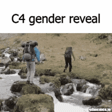 a man with a backpack is walking across a stream while another man stands on a rock .