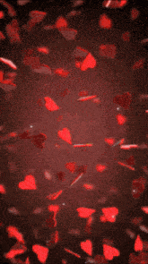 a envelope filled with red hearts is surrounded by red hearts