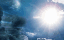 the sun shines brightly through the clouds in a blue sky