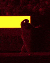 a baseball player wearing a cardinals uniform is walking on the field