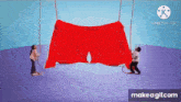 a boy and a girl are playing with a large red object hanging from a rope .