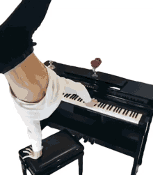 playing piano this is happening handstand balance piano