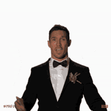 a man in a tuxedo is making a funny face with the hashtag # mafs on the bottom