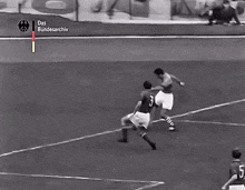 a black and white photo of a soccer game with a youtube logo in the corner