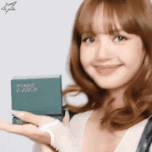 a close up of a woman holding a book that says ' a few dollars ' on it