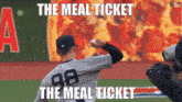 a baseball pitcher with the number 98 on his jersey