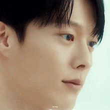 a close up of a man 's face with his eyes closed and his mouth open .