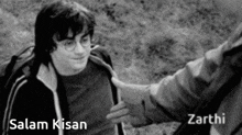 harry potter is shaking hands with salam kisan and zarthi