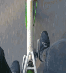 a person is riding a bicycle with a green fender