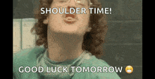 a man with curly hair is wearing a surgical gown and glasses and says shoulder time ! good luck tomorrow .