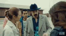 a group of people standing next to each other with the word hw on the bottom left