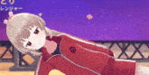 a girl wearing a red jacket with the letter r on the front