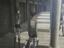 a man and a woman are standing next to each other in front of a building .