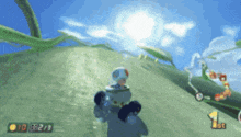 a video game screen shows a toad going up a hill with a 1st place sign