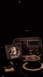 a lg radio sits next to a cd that says the best