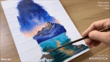 a person is painting a mountain with yellow ochre and raw umber paints