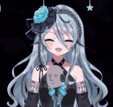 a girl with long blue hair and a flower in her hair is smiling