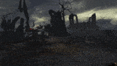 a dark landscape with a few trees and a few buildings
