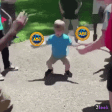 a child is dancing in front of a crowd with a circle that says dmind on it