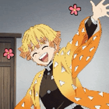a boy in a yellow jacket is standing in a room with his arms outstretched and flowers flying around him .