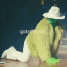 a person in a green fur coat and white hat