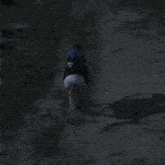 a man riding a horse on a dirt road