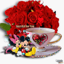 mickey mouse and minnie mouse sit next to a cup of coffee