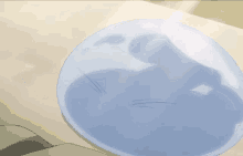 a blue whale shaped object is on a white surface