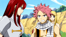 a girl with red hair is standing next to a man with pink hair