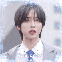 a man in a suit and tie with the name junil de lex written on the bottom