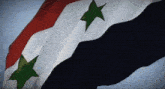 a red white and blue flag with green stars on it