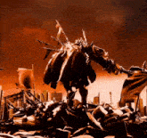 a statue of a monster is standing on a pile of rubble in front of a city