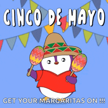a penguin is wearing a sombrero and holding two maracas