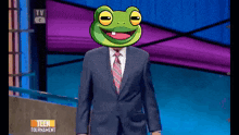 a man in a suit and tie with a frog head on a tv screen that says teen tournament