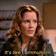 a woman in a fur coat with the words it 's like communism behind her